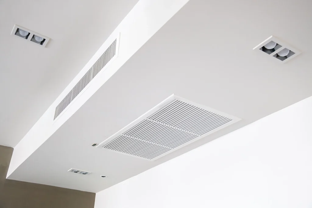 Forced air heating system ceiling vents and return grille